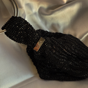 NOIR DĀNĀ WRISTLET (LIMITED EDITION)